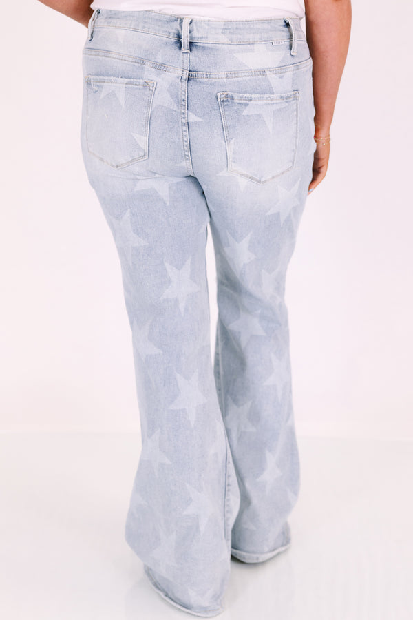 Plus Size light wash flare jeans with a white star pattern, button fly, and distressed knee.