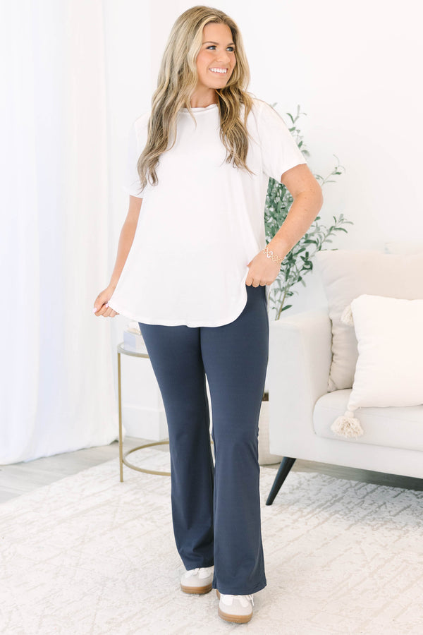 Plus Size navy blue flare leggings with a high-waisted crossover waistband.