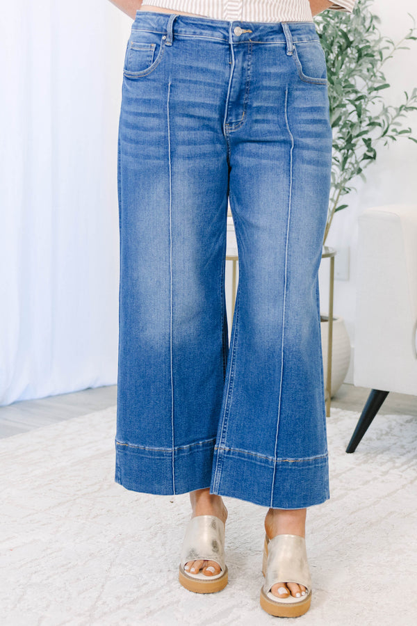 Plus Size wide-leg blue jeans with a front seam detail and a wide hem.
