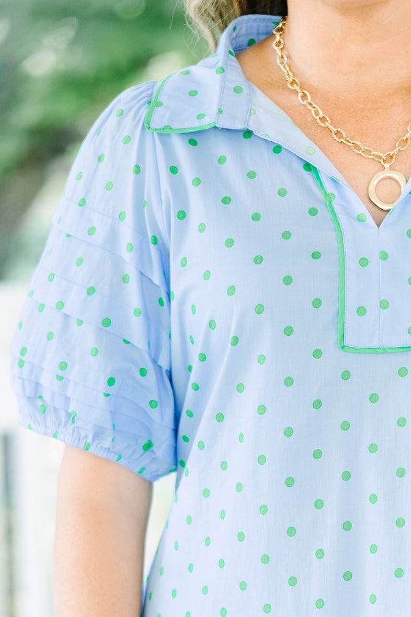 Plus Size light blue shift dress with green polka dots, tiered short sleeves, and a collared V-neck.