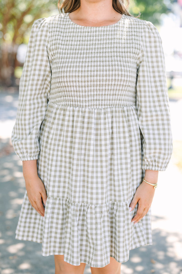 Plus Size green gingham dress with a smocked bodice, long puff sleeves, and a tiered skirt.