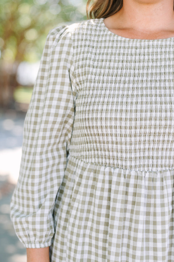 Plus Size green gingham dress with a smocked bodice, long puff sleeves, and a tiered skirt.