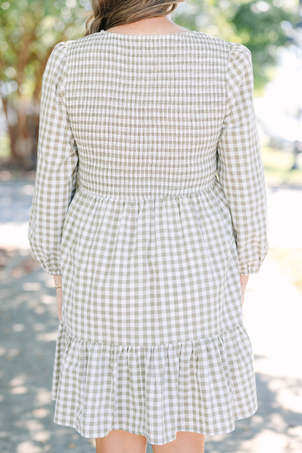 Plus Size green gingham dress with a smocked bodice, long puff sleeves, and a tiered skirt.