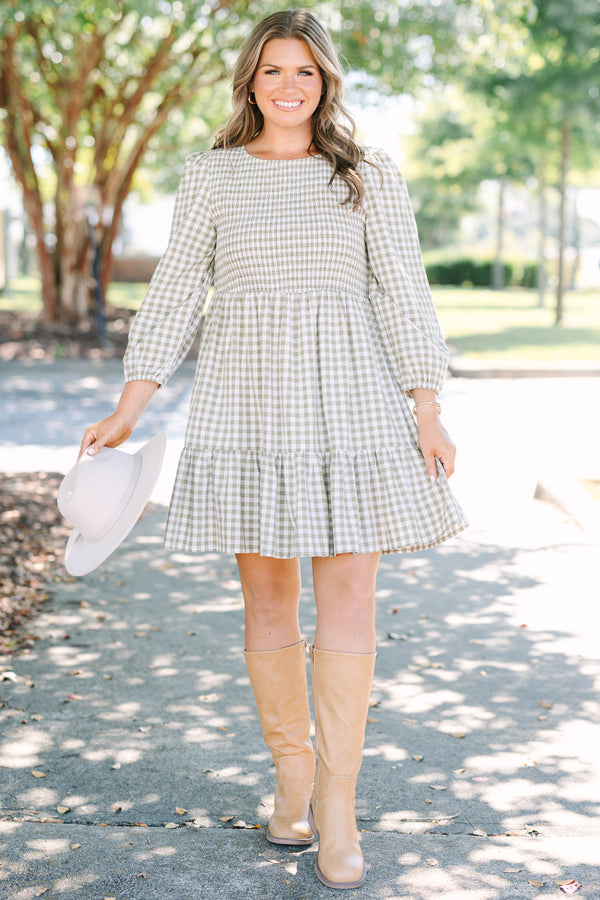 Plus Size green gingham dress with a smocked bodice, long puff sleeves, and a tiered skirt.