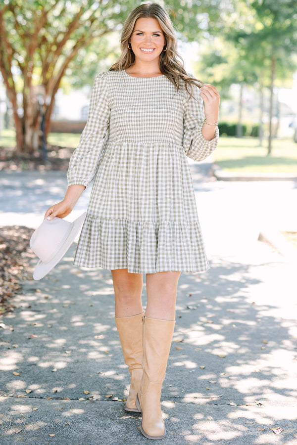 Plus Size green gingham dress with a smocked bodice, long puff sleeves, and a tiered skirt.