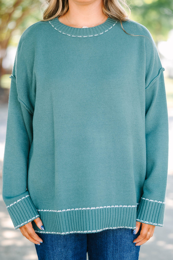 Plus Size green knit crewneck sweater with white contrast stitching on the neckline and ribbed hem.