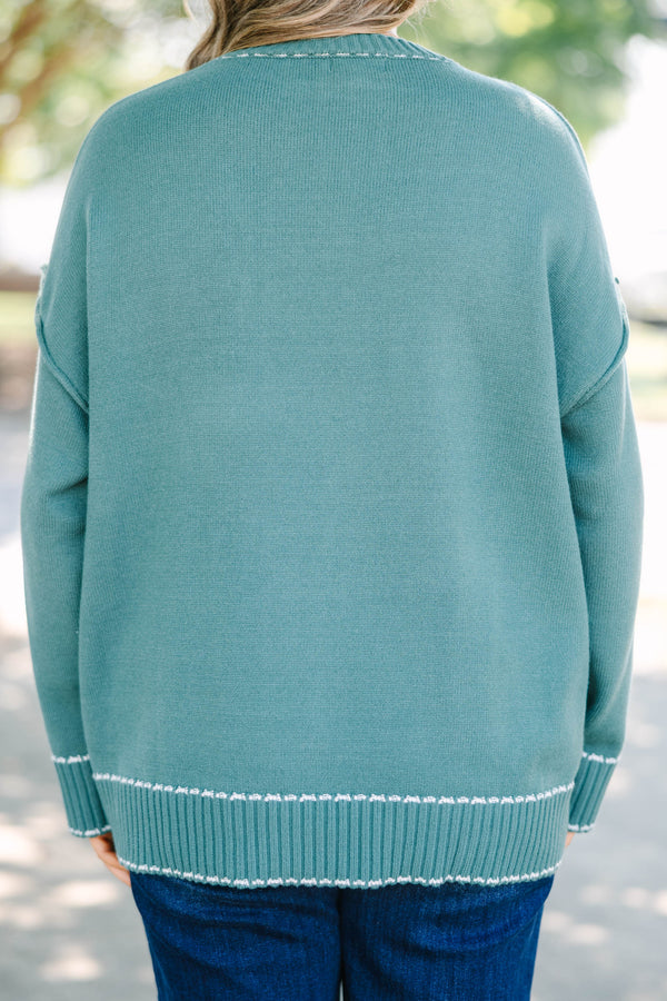 Plus Size green knit crewneck sweater with white contrast stitching on the neckline and ribbed hem.