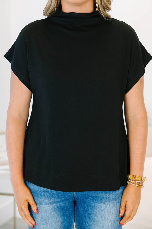 Plus Size black short sleeve mock neck top with a relaxed fit and side slits.