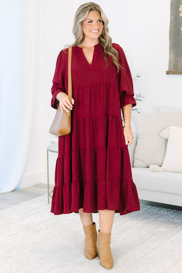 Plus Size burgundy tiered midi dress with a V-neckline and flutter sleeves in a textured fabric.