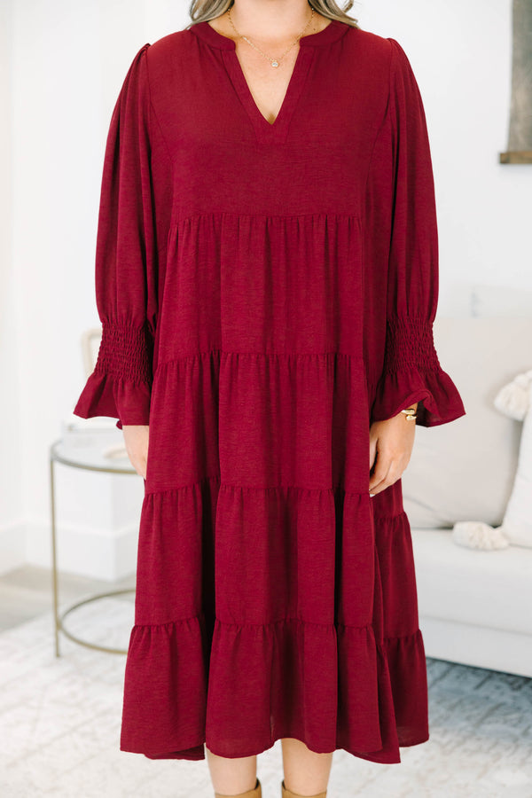 Plus Size burgundy tiered midi dress with a V-neckline and flutter sleeves in a textured fabric.