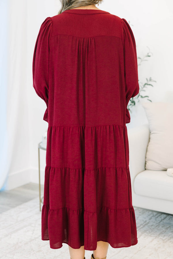 Plus Size burgundy tiered midi dress with a V-neckline and flutter sleeves in a textured fabric.
