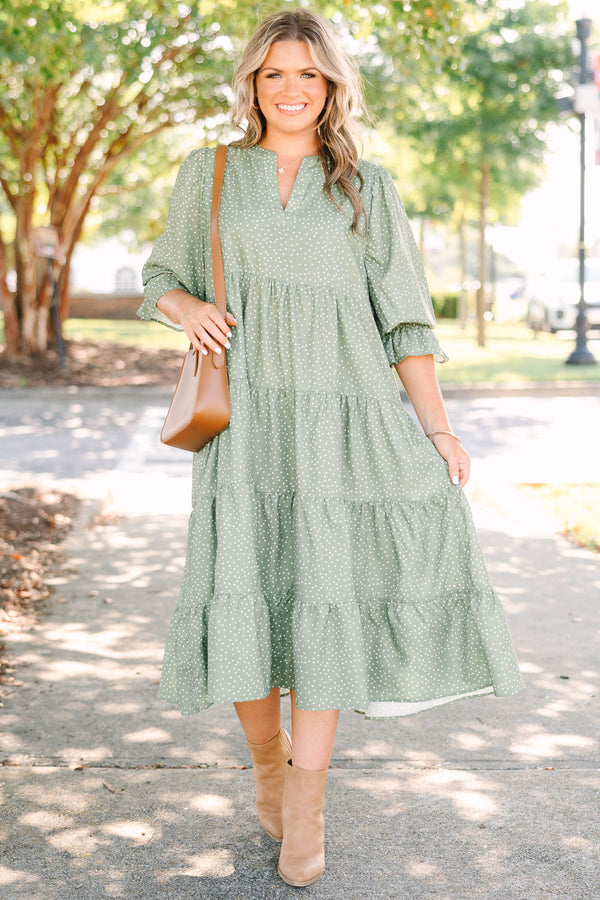 Plus Size green polka dot tiered midi dress with a v-neckline and three-quarter length sleeves.