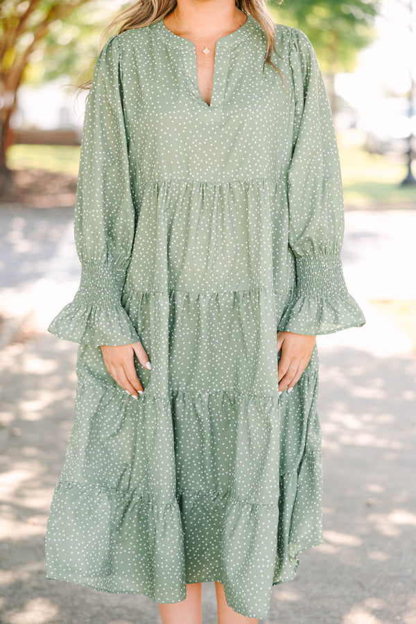 Plus Size green polka dot tiered midi dress with a v-neckline and three-quarter length sleeves.