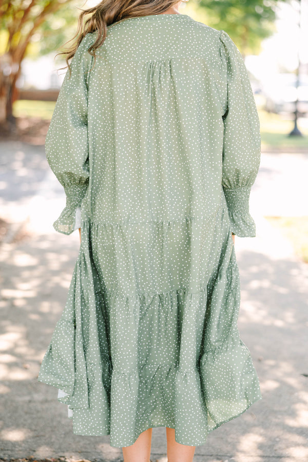 Plus Size green polka dot tiered midi dress with a v-neckline and three-quarter length sleeves.