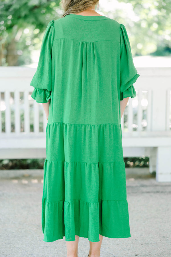 Plus Size green tiered midi dress with a V-neckline and three-quarter length sleeves.