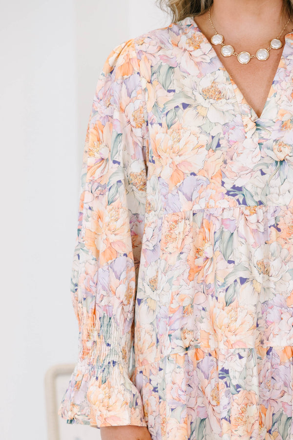 Plus Size tiered midi dress in a multi-color floral cotton fabric with long smocked cuff sleeves.