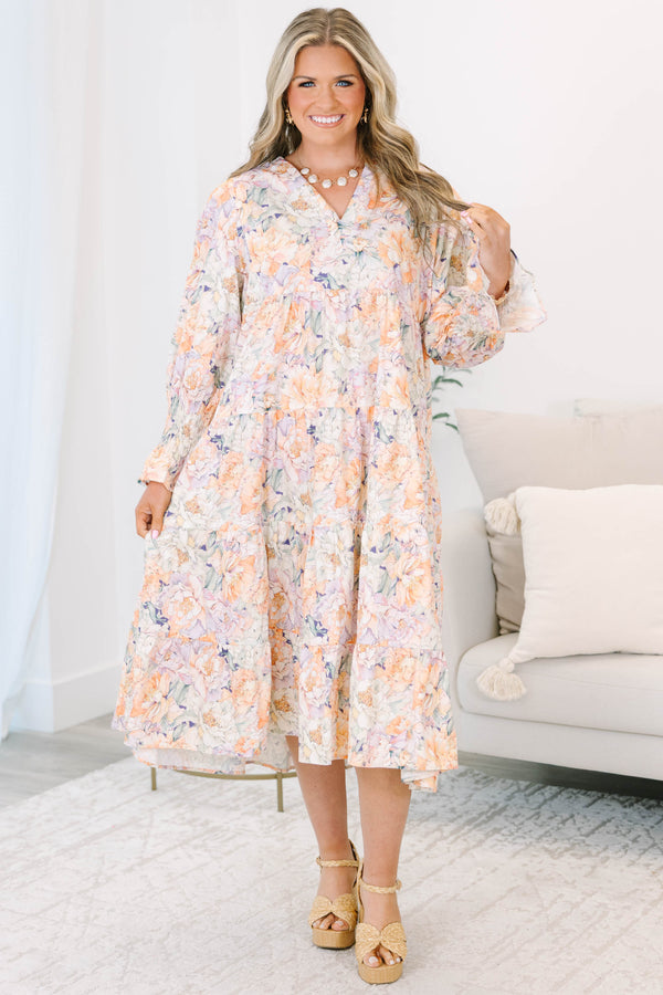Plus Size tiered midi dress in a multi-color floral cotton fabric with long smocked cuff sleeves.