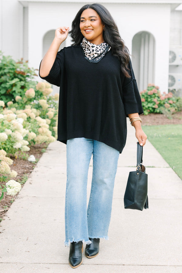 Plus Size black v-neck sweater with three-quarter sleeves and a relaxed fit in a knit fabric.