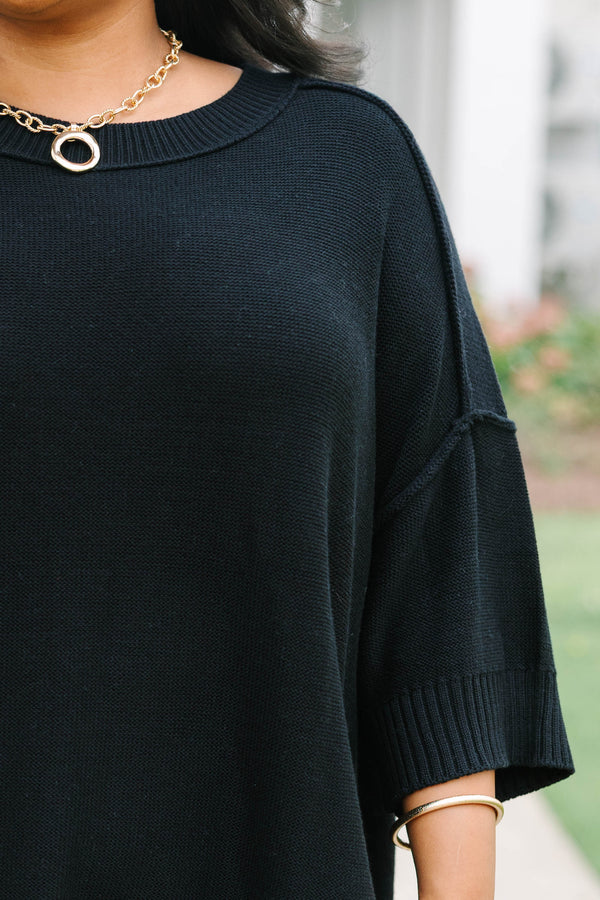 Plus Size black v-neck sweater with three-quarter sleeves and a relaxed fit in a knit fabric.