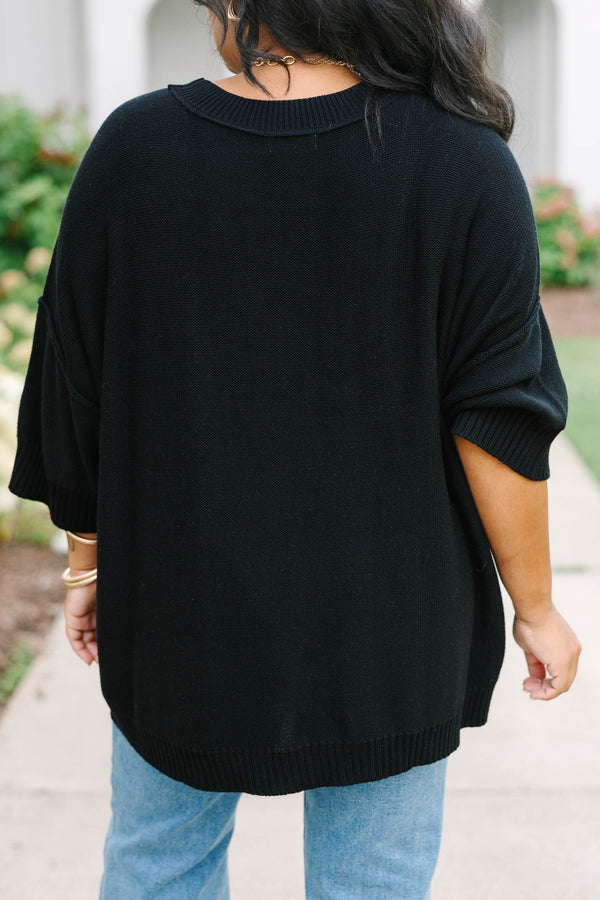 Plus Size black v-neck sweater with three-quarter sleeves and a relaxed fit in a knit fabric.