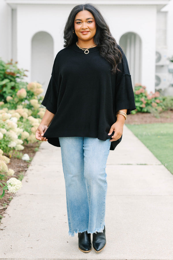 Plus Size black v-neck sweater with three-quarter sleeves and a relaxed fit in a knit fabric.