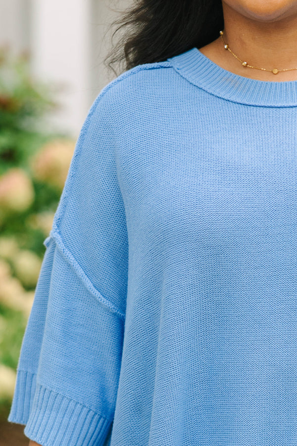 Plus size blue sweater, featuring a flowy fit and soft knit texture.