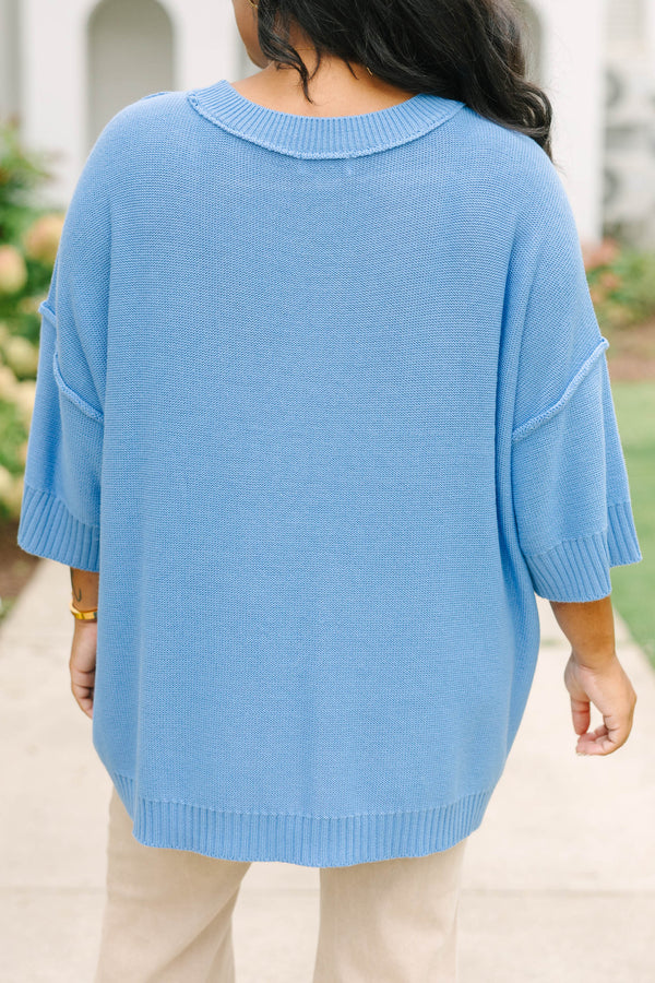 Plus size blue sweater, featuring a flowy fit and soft knit texture.