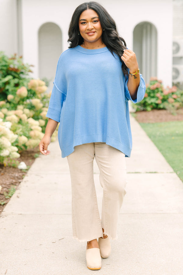 Plus size blue sweater, featuring a flowy fit and soft knit texture.