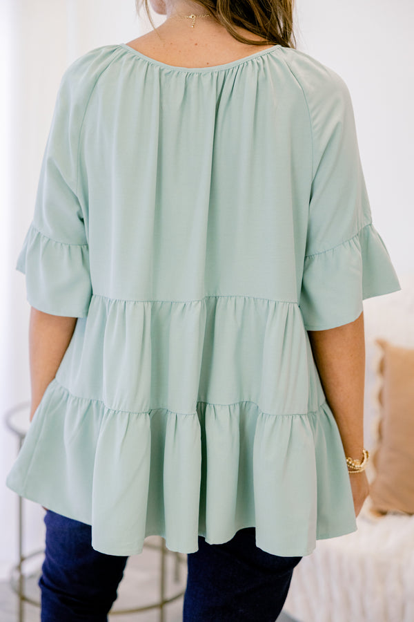 Chic Soul plus size clothing, short-sleeve ruffled dusty sage green baby doll top with a subtle v-neckline and tie on the neckline