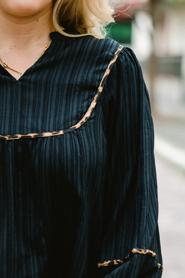 Chic Soul Plus size clothing, black long sleeve blouse with bubble that has cheetah stitching details on the sleeves bottom of the shirt and chest 