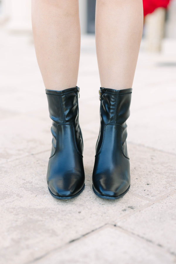 Plus size black faux leather ankle booties with a square toe and block heel.