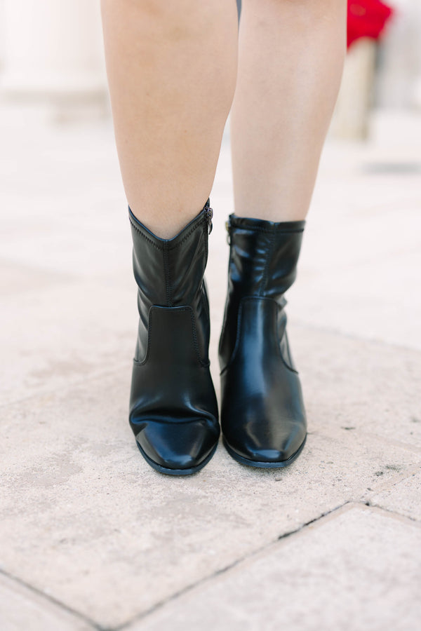 Plus size black faux leather ankle booties with a square toe and block heel.