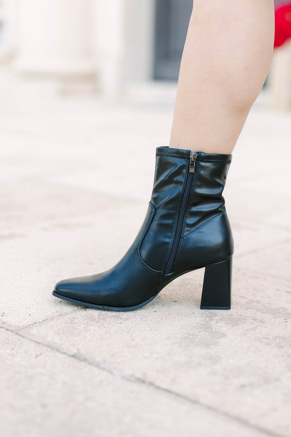 Plus size black faux leather ankle booties with a square toe and block heel.