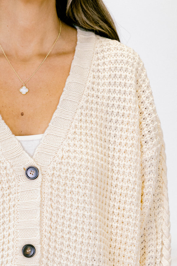 Chic Soul plus size clothing, white woven cardigan with buttons going down the center of the shirt and a slight v-neckline 