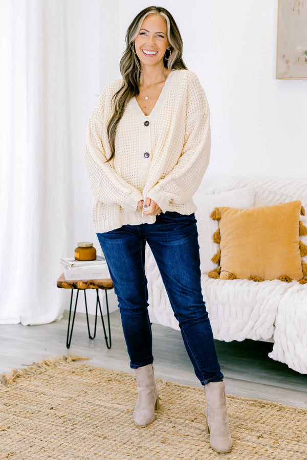 Chic Soul plus size clothing, white woven cardigan with buttons going down the center of the shirt and a slight v-neckline 