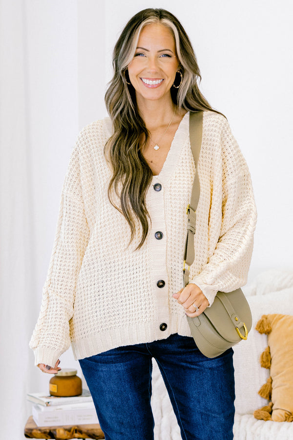 Chic Soul plus size clothing, white woven cardigan with buttons going down the center of the shirt and a slight v-neckline 