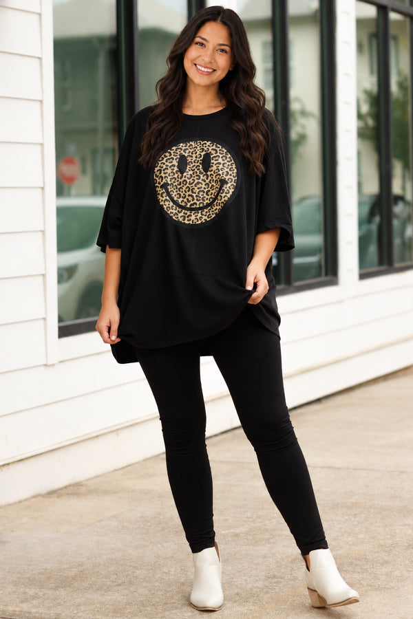 Chic Soul plus size clothing, black oversized tee with a leopard smiley graphic