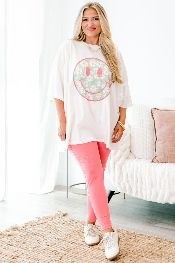 Chic Soul plus size clothing, ivory graphic tee with a pink smiley face on the center of the shirt that is filled with a blue daisy pattern 
