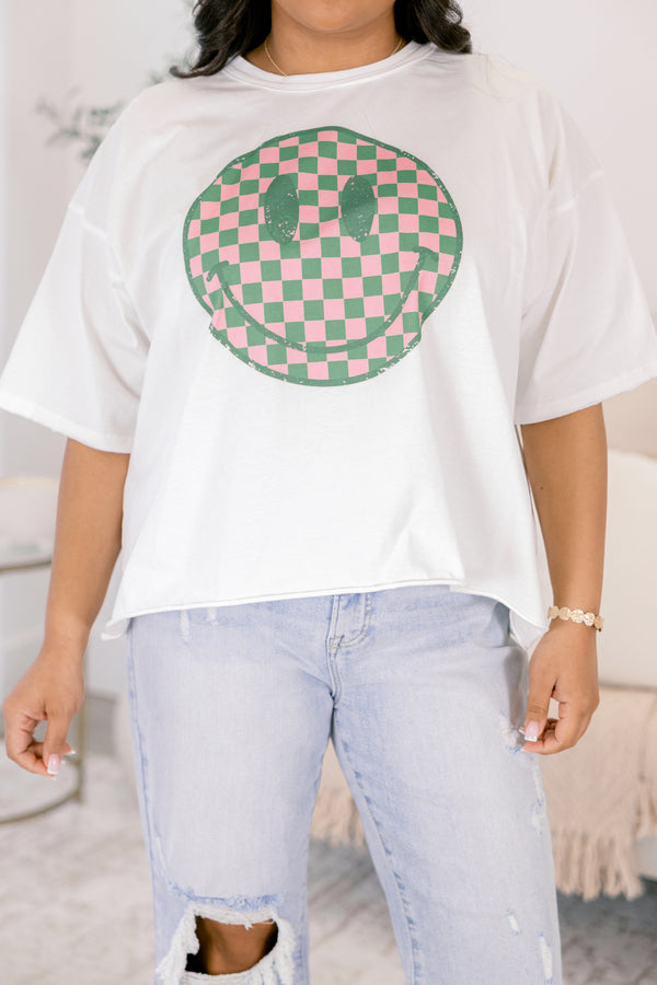 Chic Soul plus size clothing, white short sleeve graphic tee with a checkered pink and green smiley face on the center of the shirt 