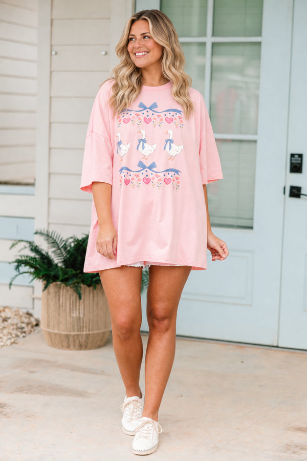 Plus Size dusty pink oversized boyfriend tee with a vintage coquette geese and bow graphic.
