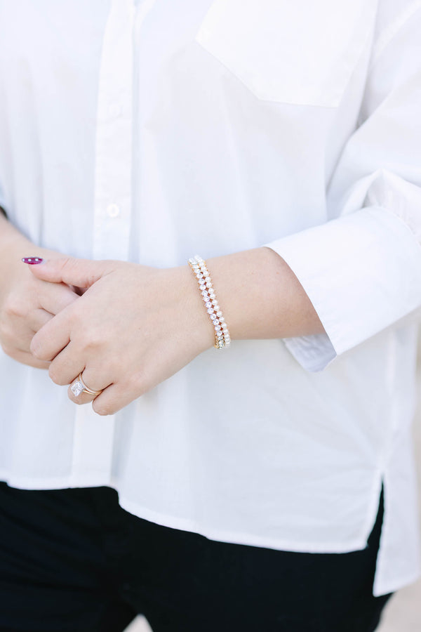 Plus Size gold bracelet featuring two rows of alternating white pearls and clear crystals.