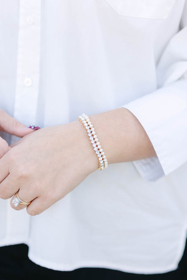 Plus Size gold bracelet featuring two rows of alternating white pearls and clear crystals.