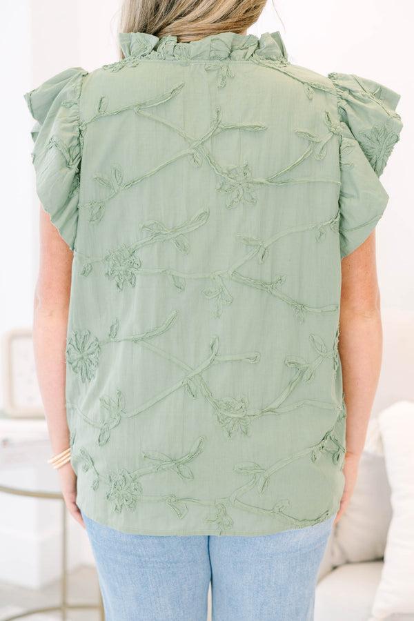 Plus Size olive green textured floral top with ruffle cap sleeves and a button-down front.