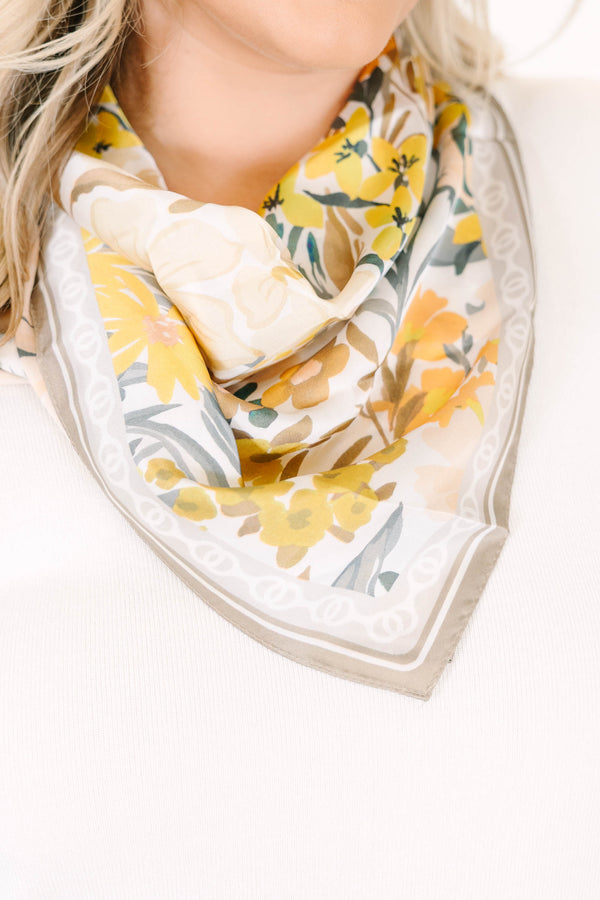 Plus Size floral scarf in brown and yellow with a soft drape and decorative border.