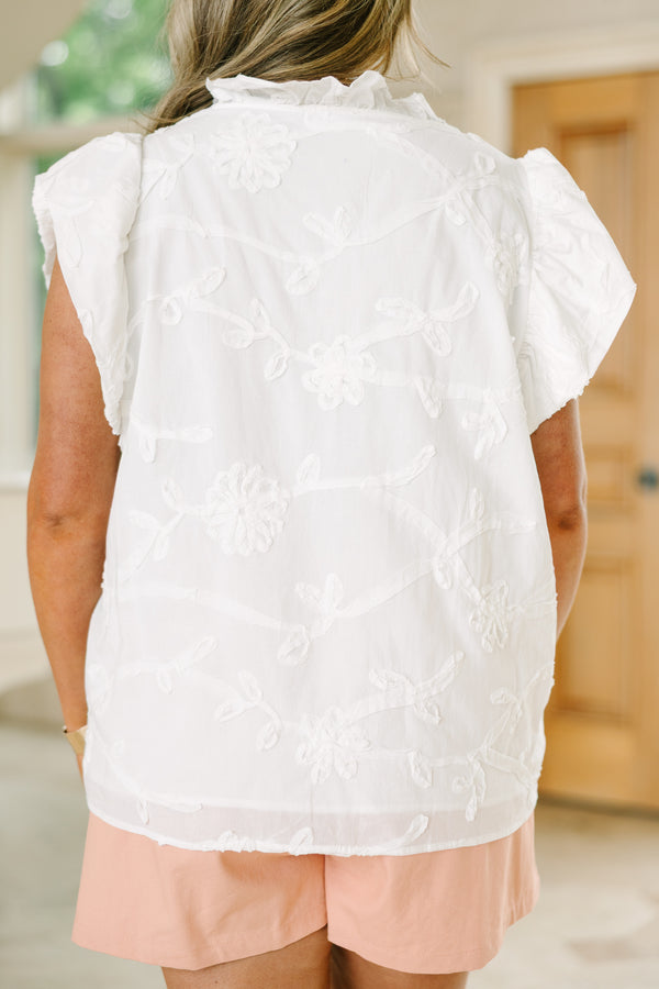 Plus Size white floral jacquard top with ruffle v-neckline and flutter sleeves.