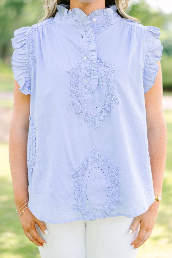 Plus Size light blue sleeveless top with ruffle trim, high neck, and intricate floral embroidery.