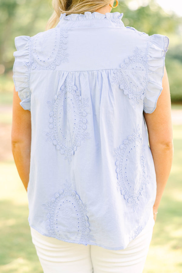 Plus Size light blue sleeveless top with ruffle trim, high neck, and intricate floral embroidery.
