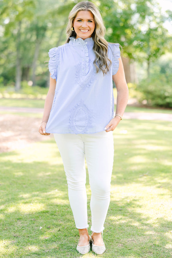 Plus Size light blue sleeveless top with ruffle trim, high neck, and intricate floral embroidery.