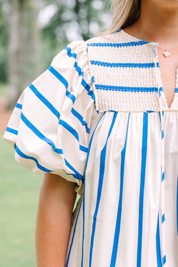 Plus Size blue and white striped cotton dress with smocked split neck and puff sleeves.