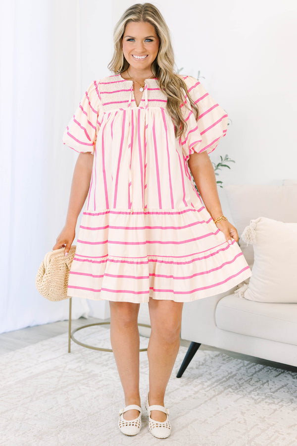 Plus Size pink and cream striped mini dress with puff sleeves, smocked yoke, and tiered skirt.